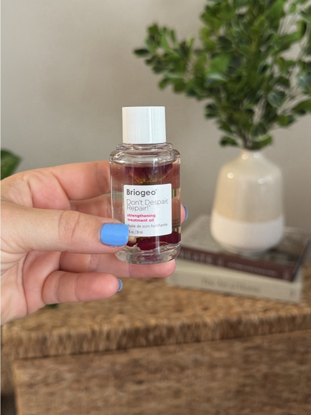 Briogeo Strengthening Treatment Oil with White Cap and Blue Nail Accent